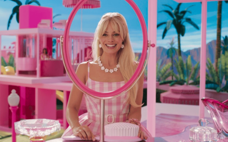 Image from the Barbie movie of Barbie sitting in her dream house